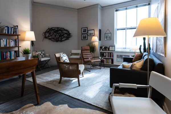Inside Jennifer Roy's therapy office, a calm sitting room with soft seating