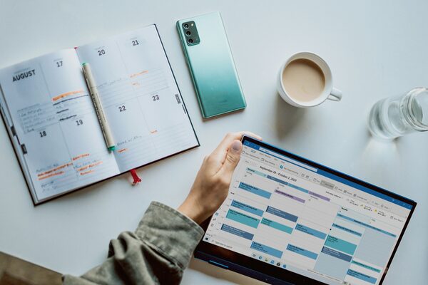 Scheduling a therapy session using a calendar app, planner, and phone